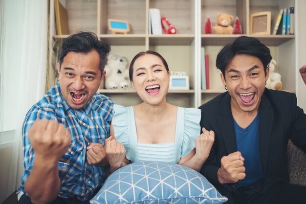 Three friend The are big glad after watching TV