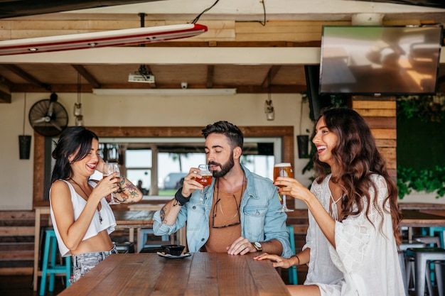 Three friends drinking beer