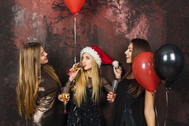 Three girls celebrating new year together