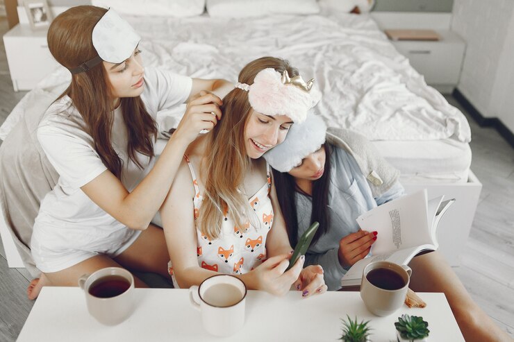 Free Photo three girls have pajamas party at home