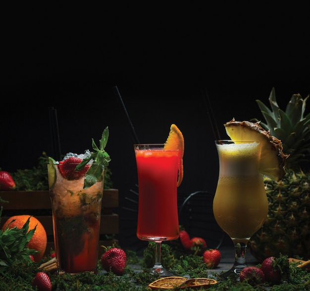 Three glasses of tropical fruit cocktails