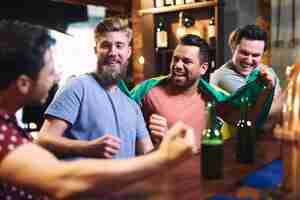 Free photo three guys watching american football competition