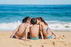 Free photo three kids at the beach