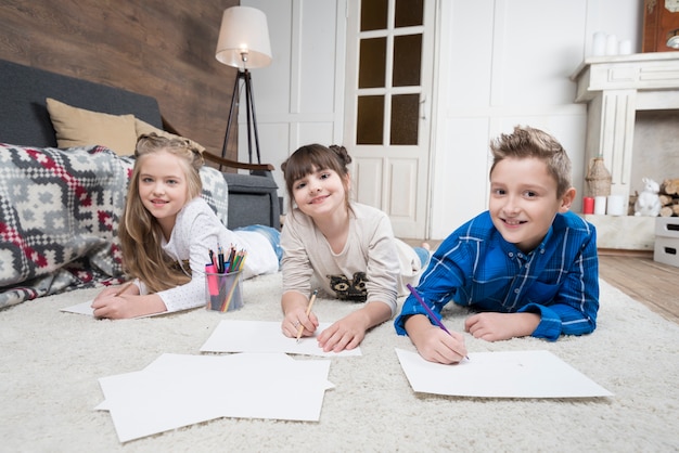 Free photo three kids doing homework