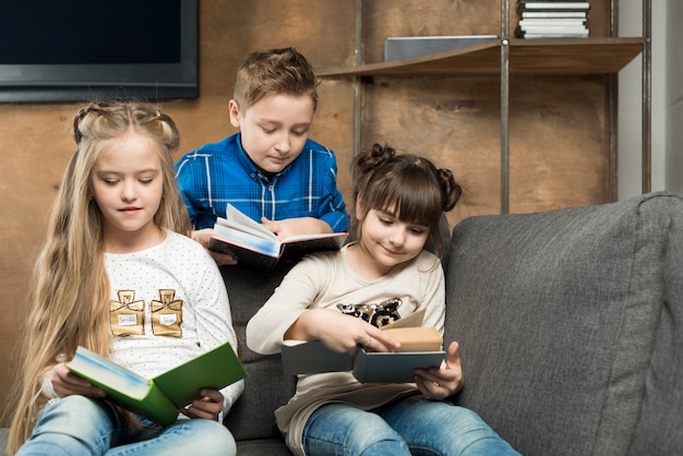 Three kids reading