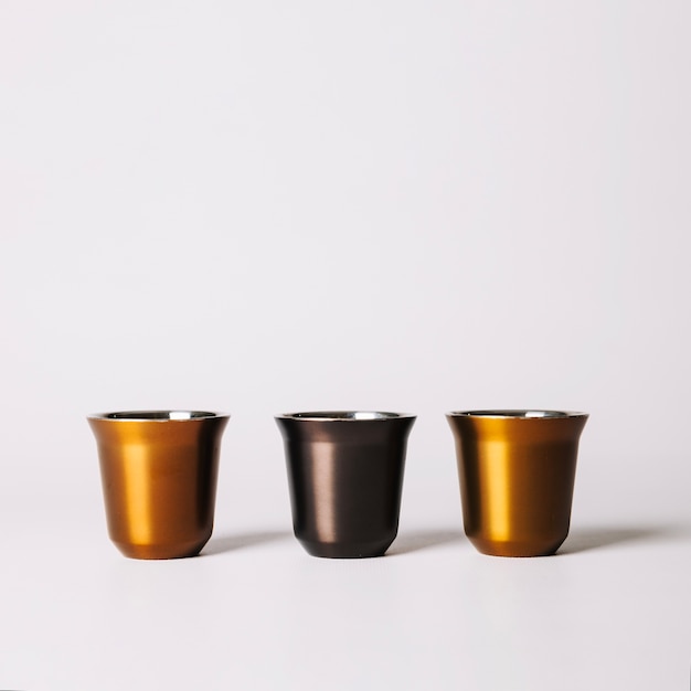 Three metallic coffee cup