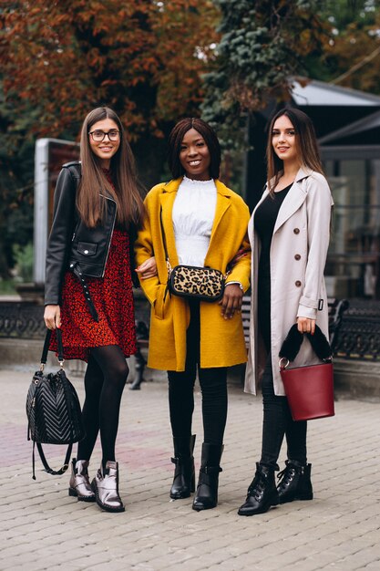 Three multicultural women after shopping