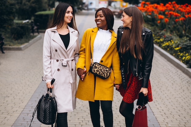 Free photo three multicultural women after shopping