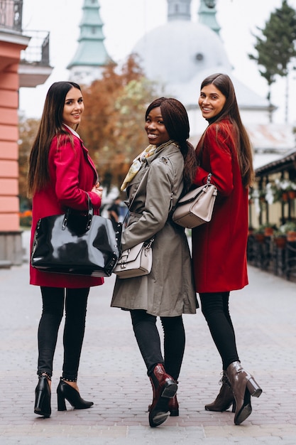 Three multicultural women in the street