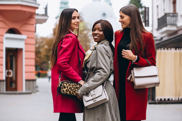 Free photo three multicultural women in the street