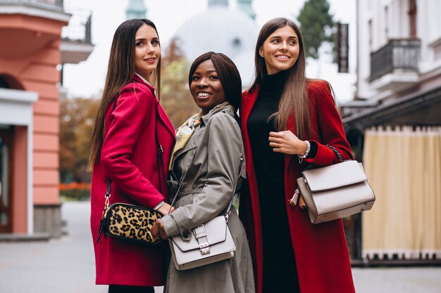 Three multicultural women in the street