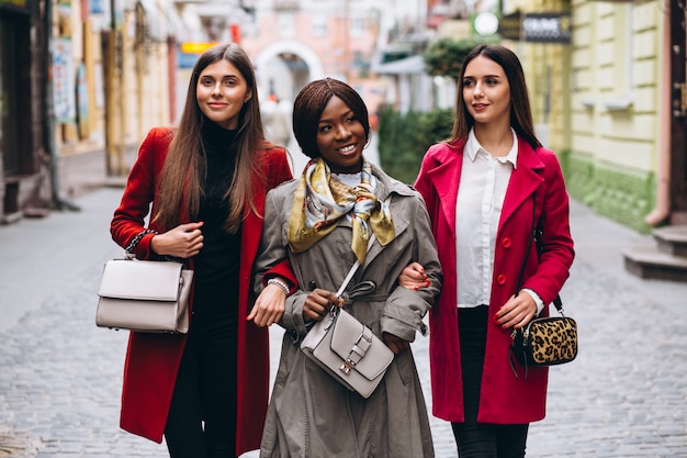 Three multicultural women in the street