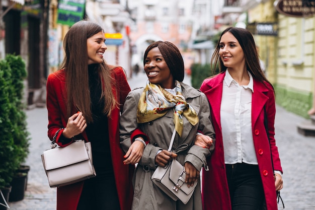 Free photo three multicultural women in the street