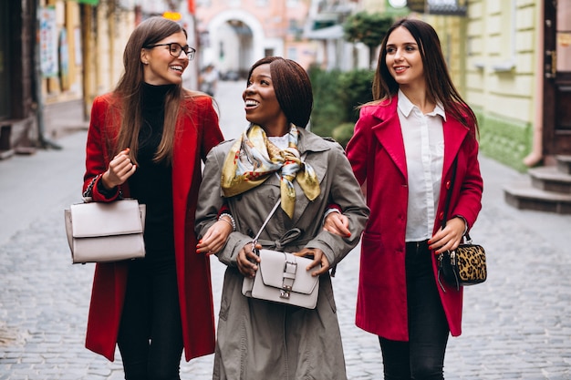 Three multicultural women in the street