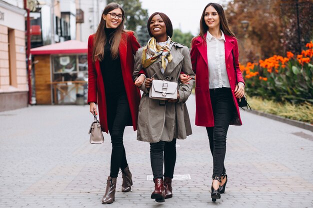 Three multicultural women in the street