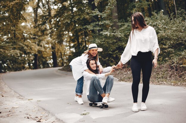 Three pretty girls in a summer park  