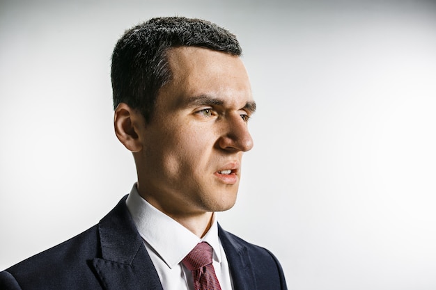 Three-quarter portrait of a businessman with disgust face.