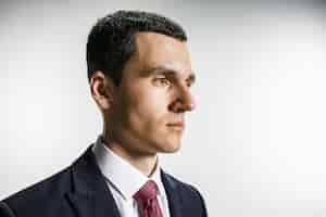 Free photo three-quarter portrait of businessman with serious face.