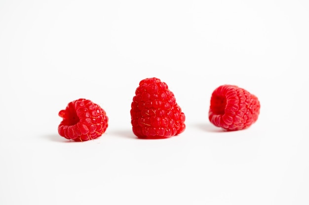 Three raspberries isolated