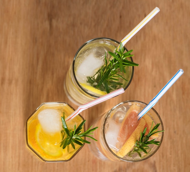 Three refreshing drinks with straws