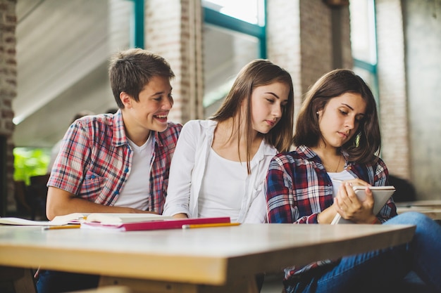 Three students in cafe