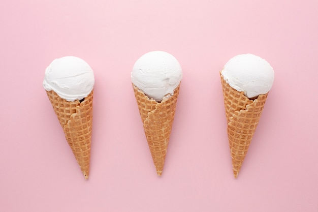 Three white ice creams on table