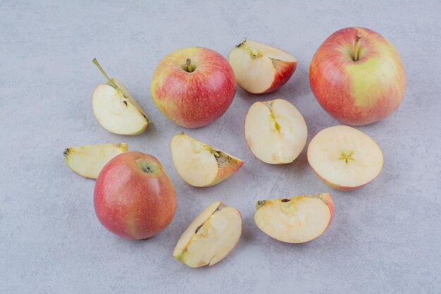 Three whole apple with slices on white background. High quality photo