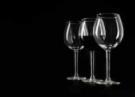 Free photo three wineglasses on black