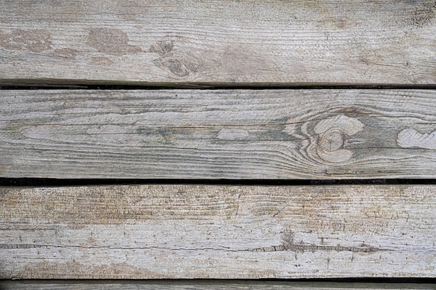 Three wooden boards with horizontal lines. Wooden background.