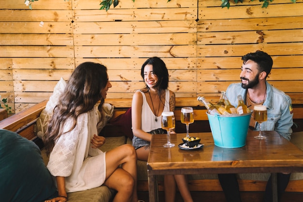 Three young friends in bar