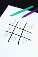 Free photo tic-tac-toe game played with woman and man gender symbols equality