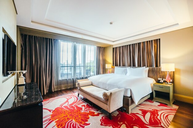 Tidy hotel room with brown curtains