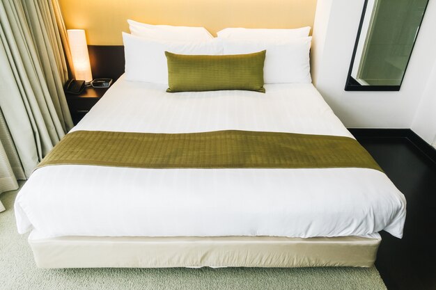 Tidy hotel room with golden cushion