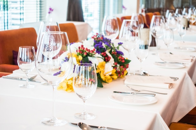 Tidy table with glasses and plates