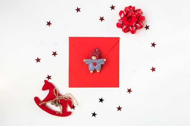 Free photo tie with a doll and a toy horse on a white background