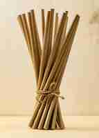 Free photo tied bamboo organic straws front view