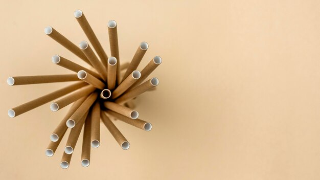 Free photo tied bamboo organic straws top view