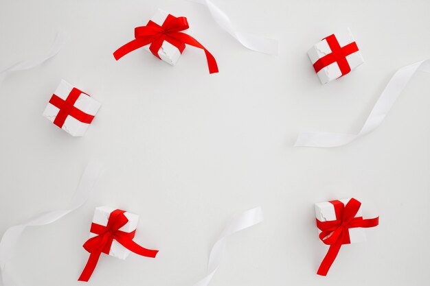 ties and christmas gifts on white background with copyspace in the middle