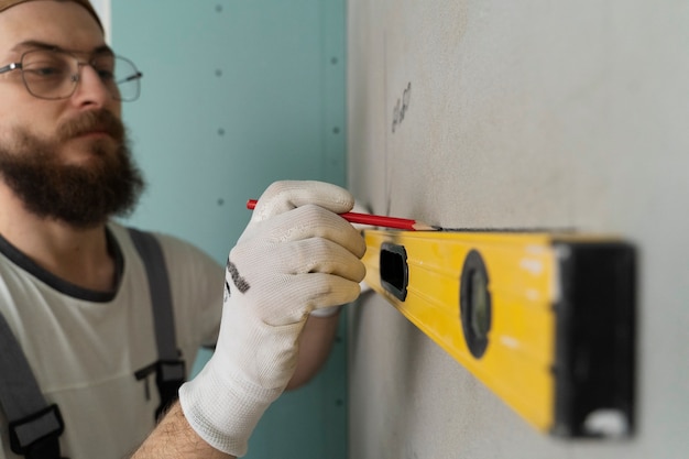 Tiler working on renovation of apartment