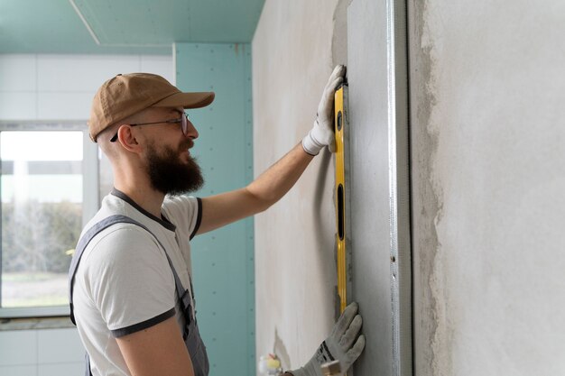 Tiler working on renovation of apartment