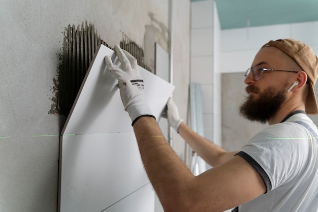 Tiler working on renovation of apartment