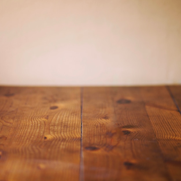 Timber planks near beige wall