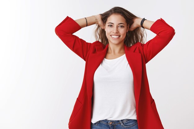 Time rest. Portrait of relaxed relieved happy young good-looking female entrepreneur finished work massaging head playing hair smiling broadly joyful, joyful weekend finally came, white wall