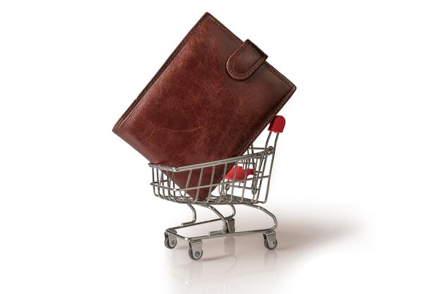 Time for shopping. supermarket trolley with wallet. on white background.