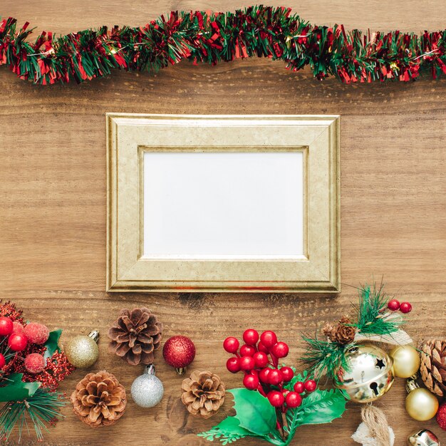 Tinsel and decorations for christmas with golden frame