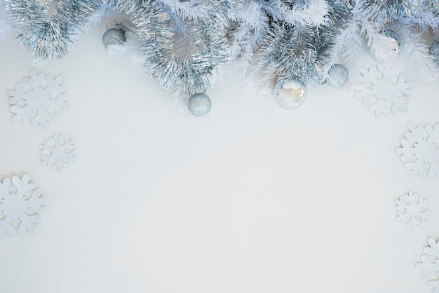 Free photo tinsel with shiny baubles on table