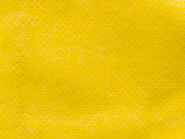 Free photo tiny dotted yellow fabric textile textured