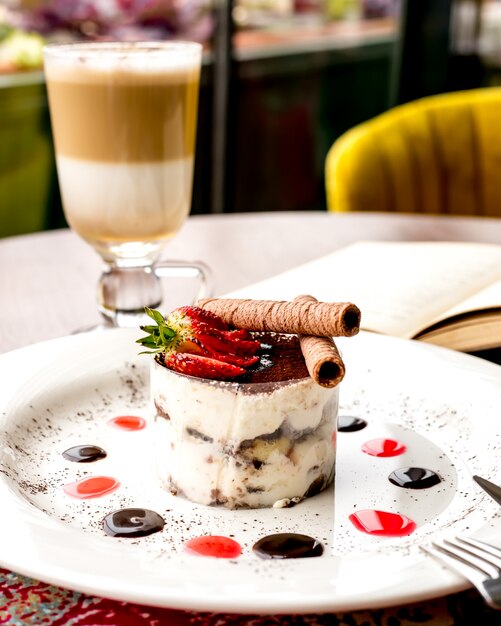 Tiramisu savoyardi cookies espresso mascarpone cheese rum cinnamon strawberry side view