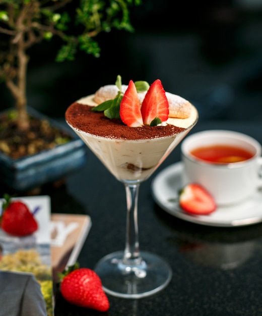 Tiramisu with strawberry on the table