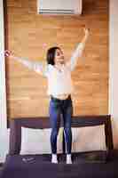 Free photo tired attractive woman work at home stretching arms to relax after hard day